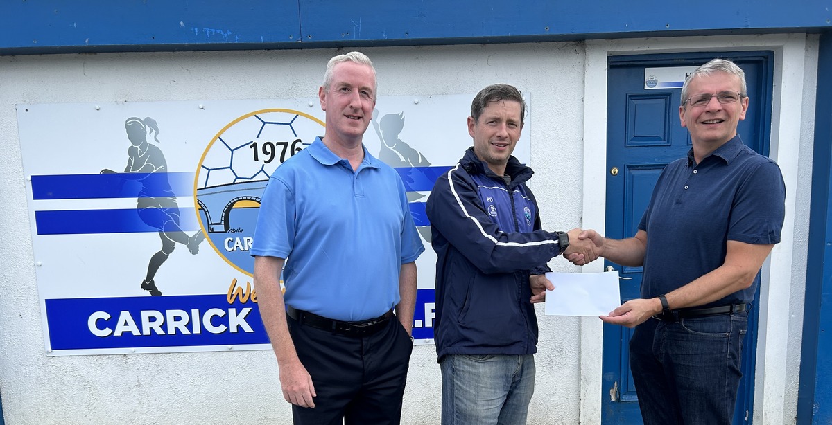 Fergal Donlon of Carrick Town F.C. (centre) presents Clement Gaffney and Brendan Lowe of The SRC with a donation of €10,000 on behalf of the soccer club's members.
